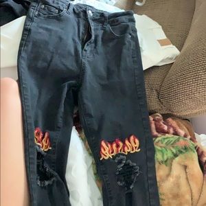 Black jeans with flames stitching